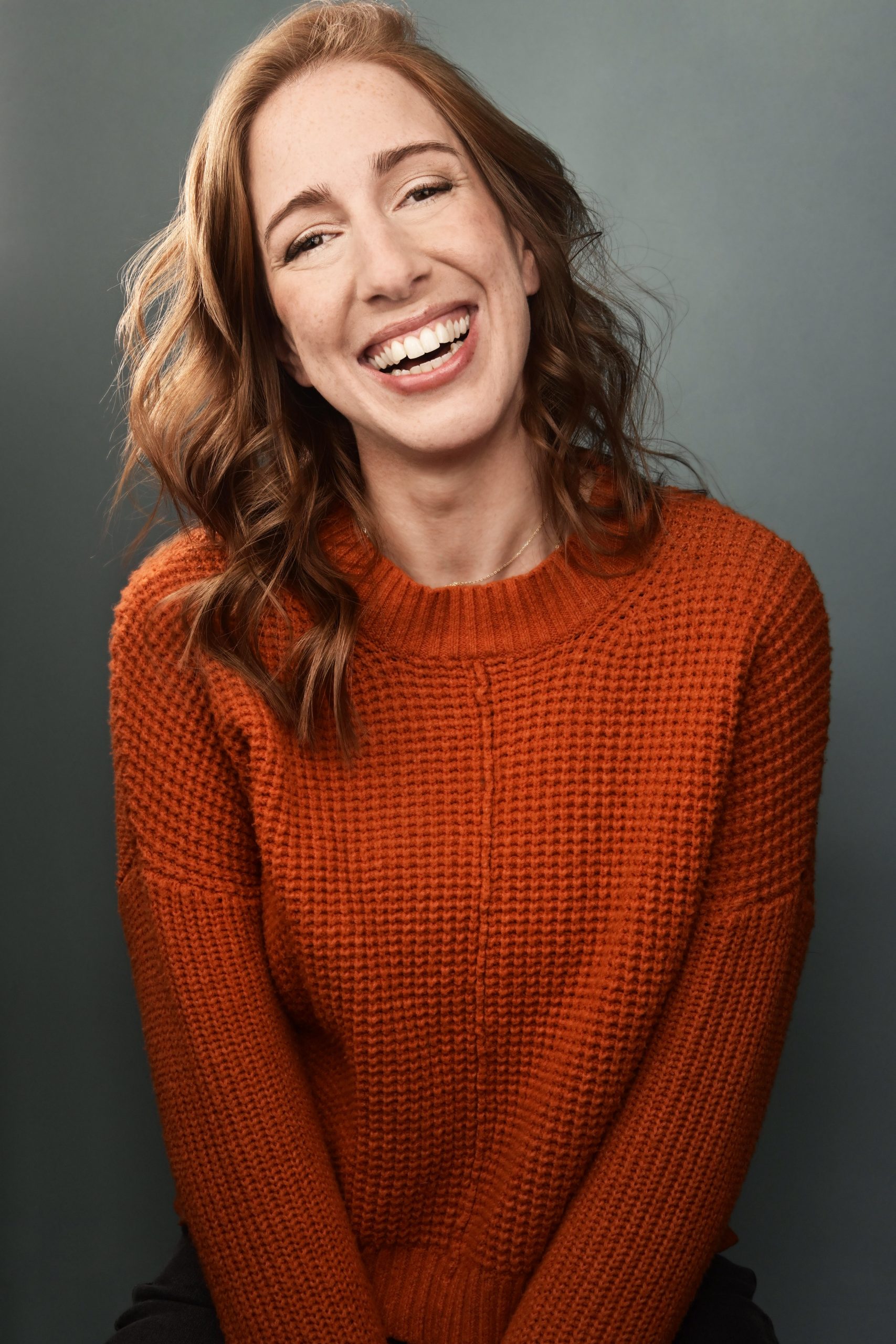 Rachel Wright Headshot Orange Sweater Grey Background Rachel Wright, MA, LMFT